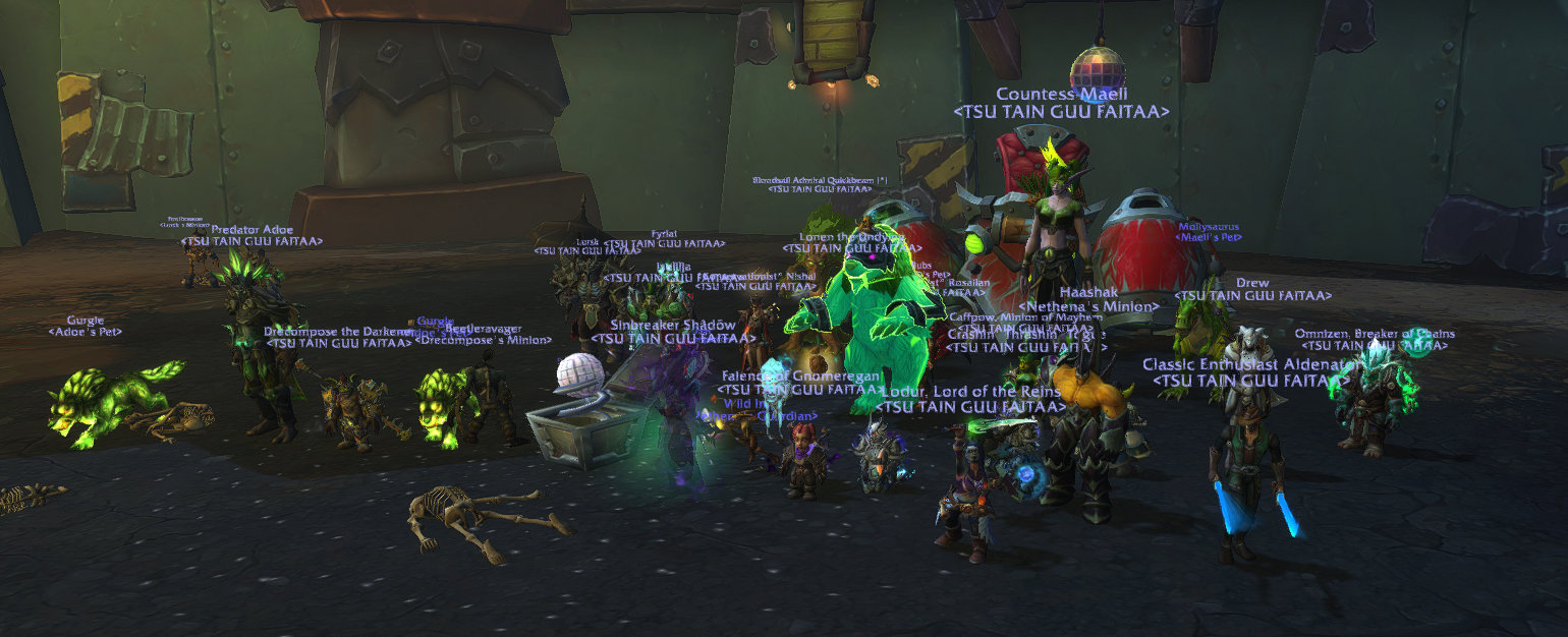 Screenshot from World of Warcraft of TTGF’s heroic raid team gathered around a defeated Rik Reverb, one of the bosses in The Liberation of Undermine raid